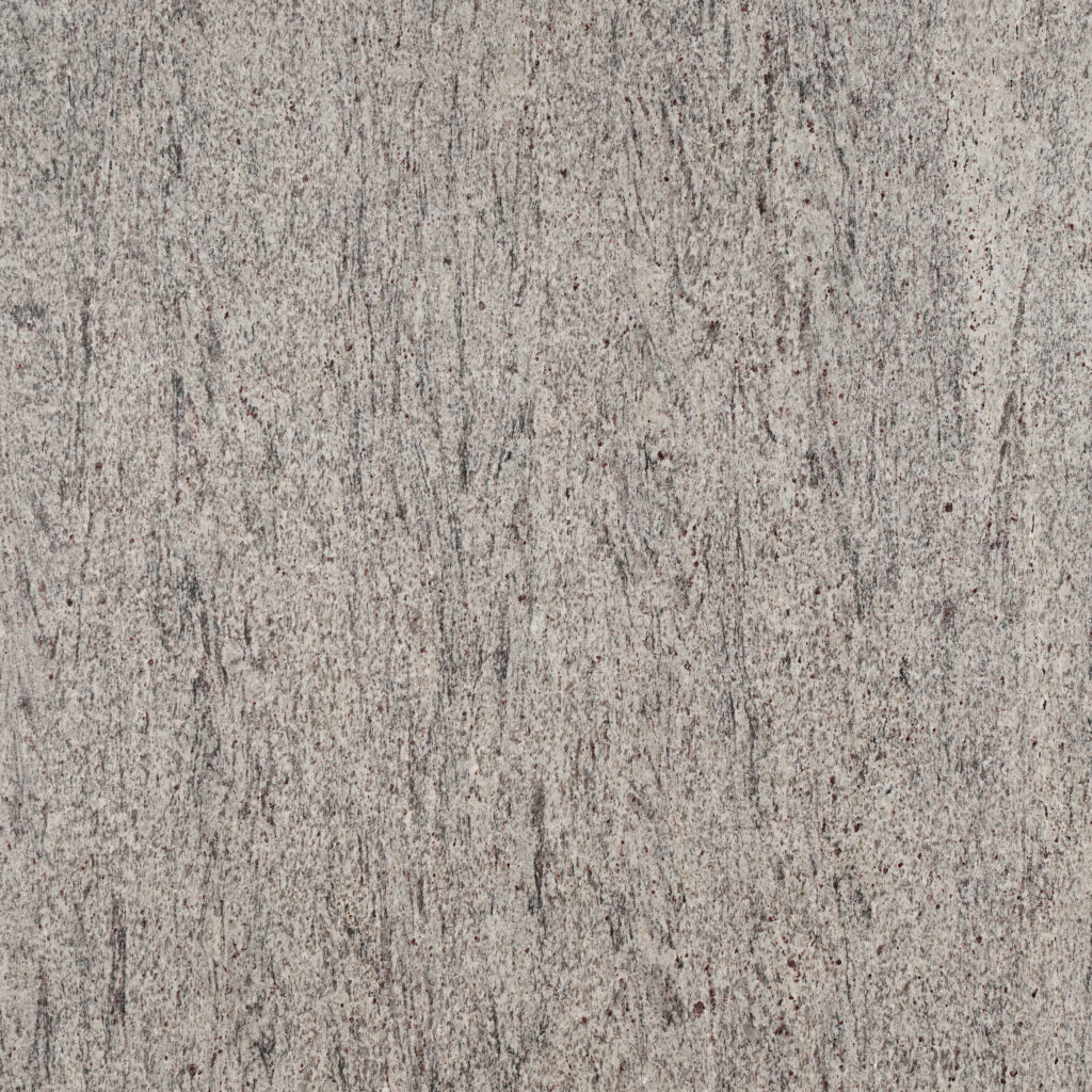 Silky Silver granite xám nhạt mịn, vân dọc mảnh như tia mưa, chấm đỏ nâu li ti. Dễ phối mọi phong cách, cho bếp, lavabo, lát sàn. Vistones Global.