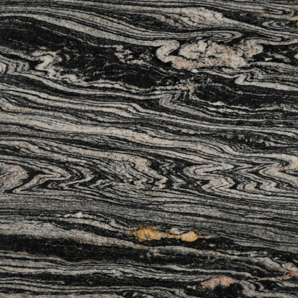 Exotic Gold granite nền đen, vân kem uốn lượn như sóng gỗ, điểm vàng hổ phách. Độc bản cho mặt bếp, quầy bar, ốp tường. Xem tại Vistones.
