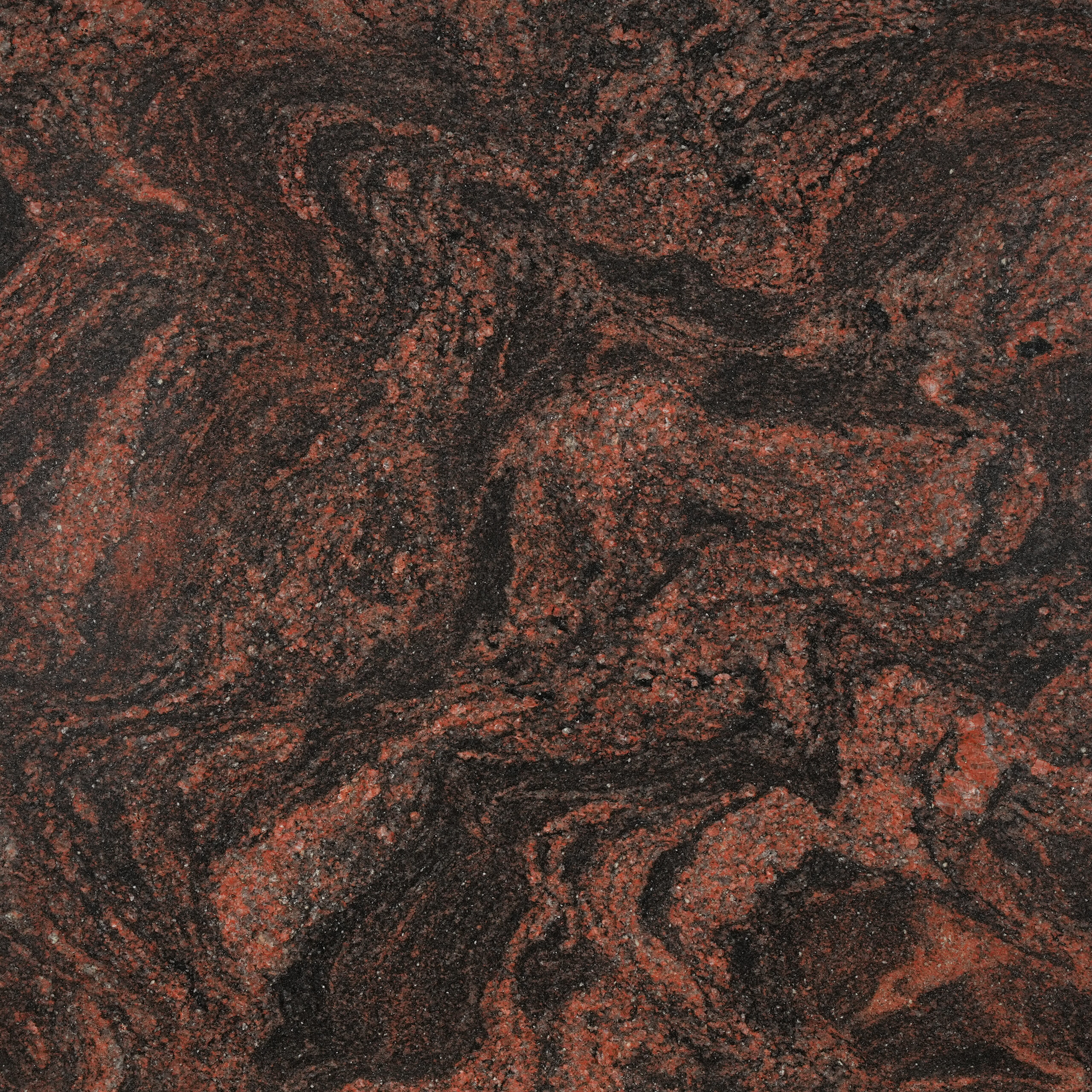 Indian Aurora granite nền đen than, dải đỏ gạch cuộn xoáy như cực quang. Điểm nhấn cho mặt bếp, quầy bar, ốp tường. Liên hệ Vistones Global.