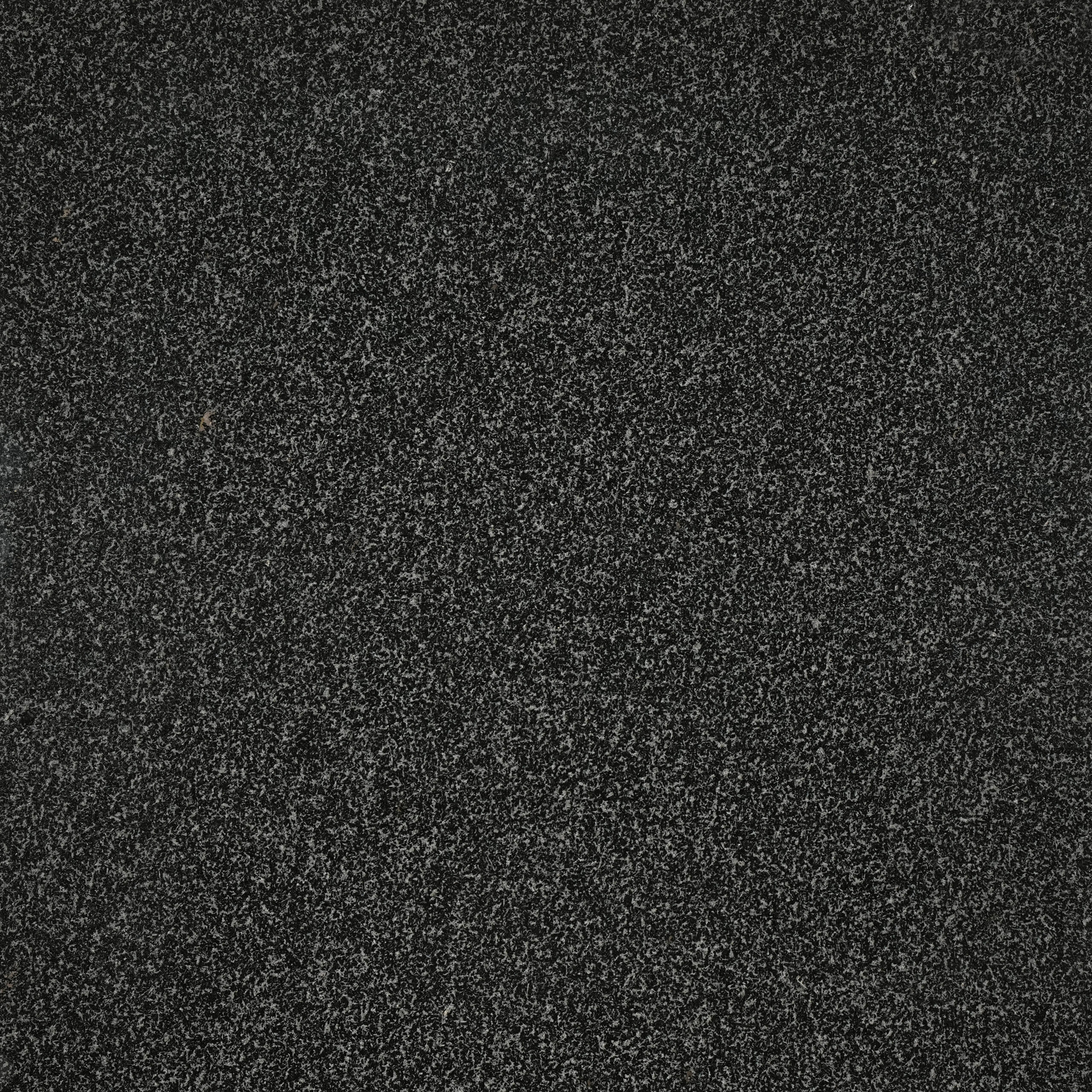 Indian Impala granite nền đen than, hạt xám mịn đồng nhất, trầm lắng. Hiện đại cho mặt bếp, lát sàn, ốp tường. Liên hệ Vistones Global.