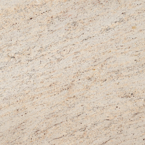 Ivory Brown granite be kem ấm áp, chấm nâu chocolate, vân chéo mảnh nhẹ. Dễ phối mọi phong cách, cho bếp, lavabo, lát sàn. Xem tại Vistones.