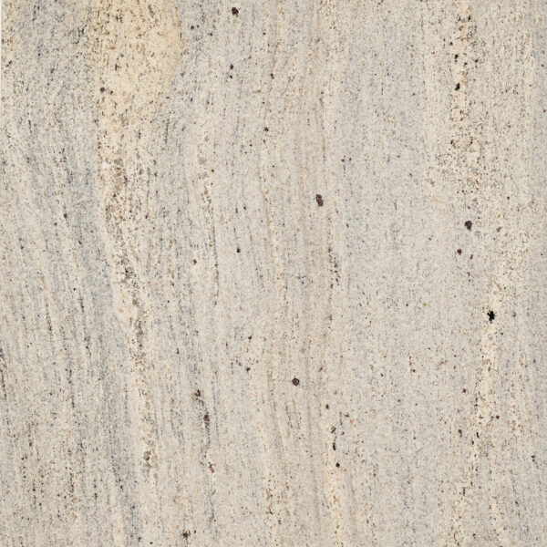 Millenium Cream granite be ngà, vân dọc mềm, chấm nâu đỏ, dải vàng kem sáng. Ấm cúng cho mặt bếp, lát sàn, ốp tường. Xem tại Vistones Global.