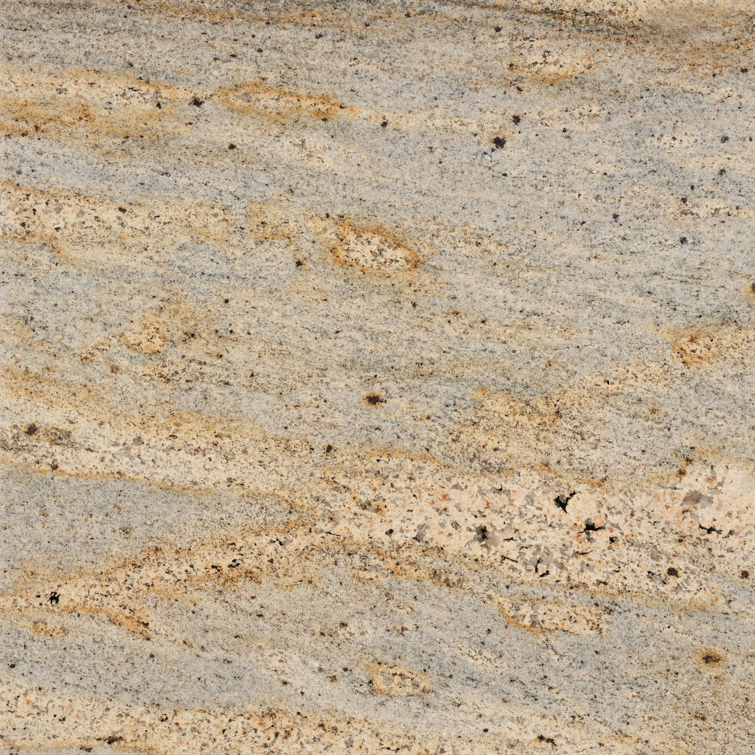 Millenium Gold granite dải vàng mật ong, cam nhạt kết tinh trên nền xám dịu. Ấm áp điềm đạm cho mặt bếp, bàn đảo, ốp tường. Vistones Global.