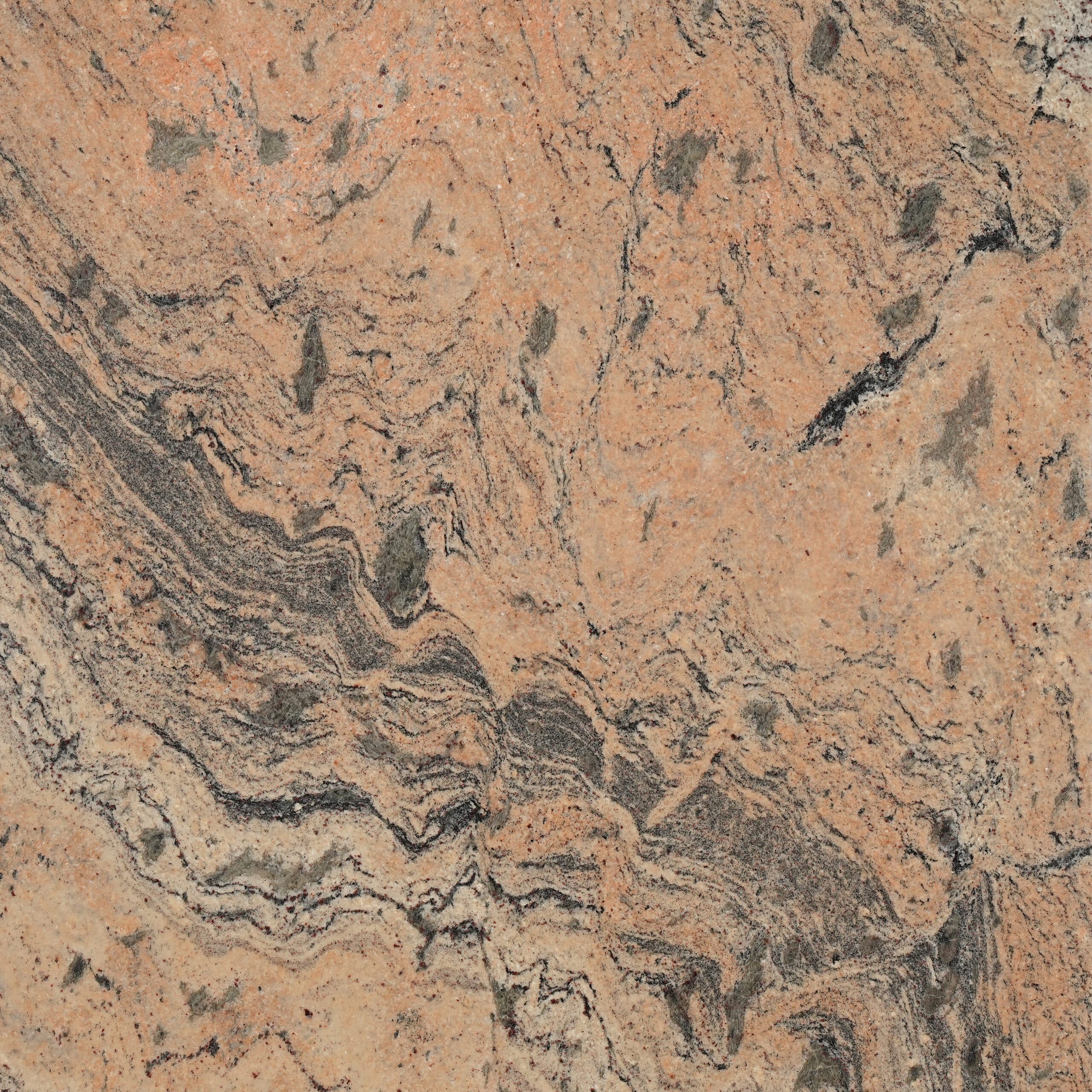 Prada granite nền cam hồng đào, vân xám than uốn lượn, mảng xanh xám như rêu. Phóng khoáng cho mặt bếp, bàn đảo, ốp tường. Xem tại Vistones.